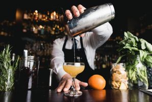 Bartender serving a cocktail